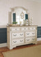 Realyn  Upholstered Panel Bed With Mirrored Dresser