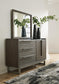 Arkenton  Panel Bed With Mirrored Dresser