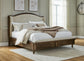 Sturlayne  Upholstered Panel Bed, Dresser, Mirror And Nightstand