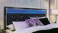 Kaydell  Upholstered Panel Bed With Mirrored Dresser